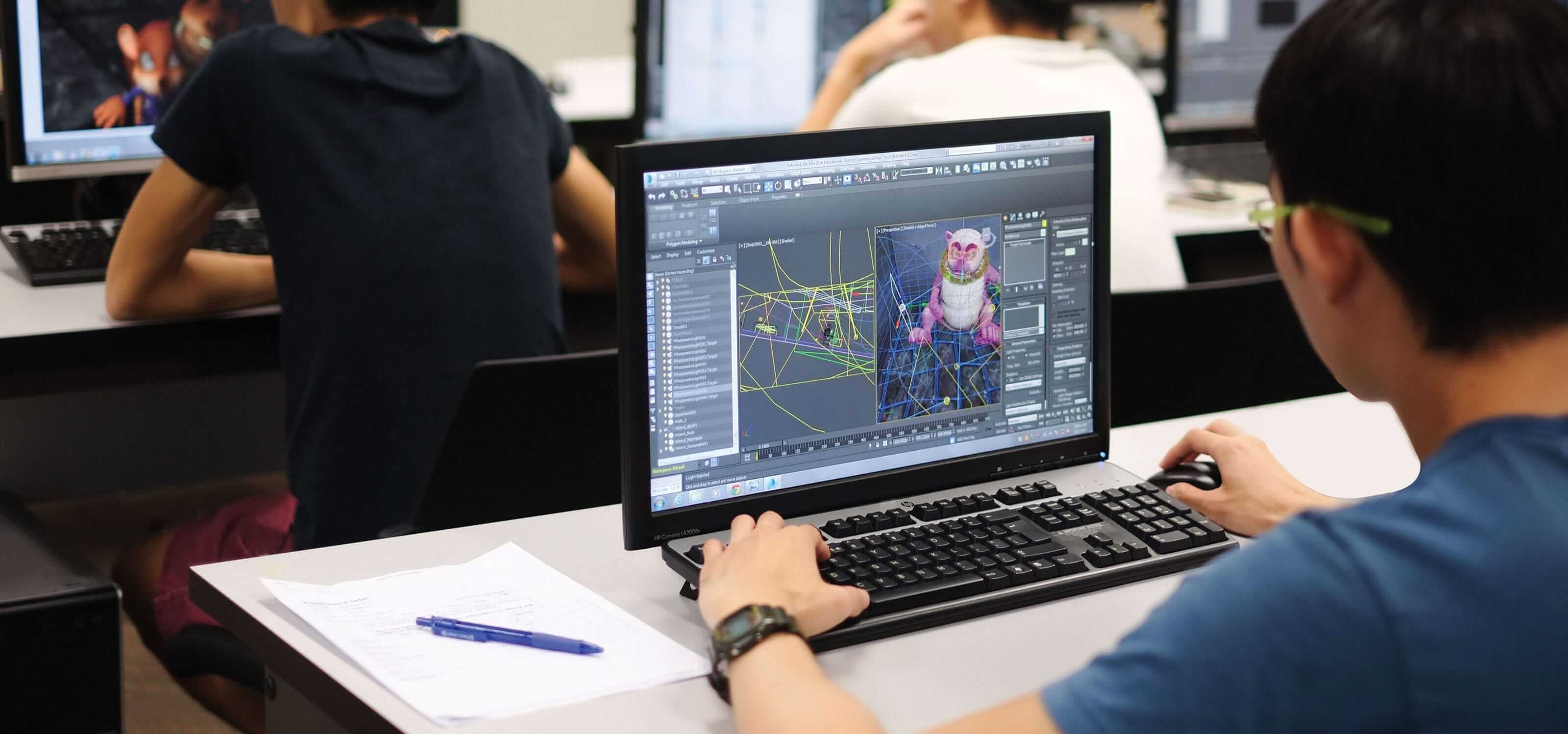 Looking over the shoulder of a DigiPen (Singapore) student as he creates a 3D model of an animal on a computer