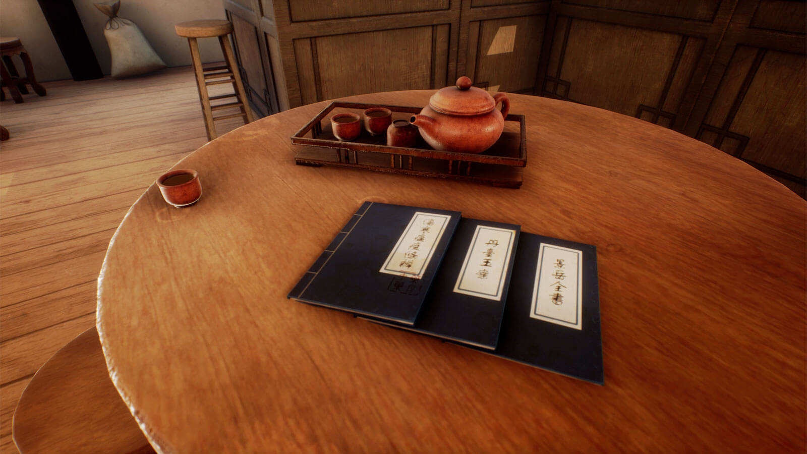Three menus and a tea set collection lay at the top of a round table.