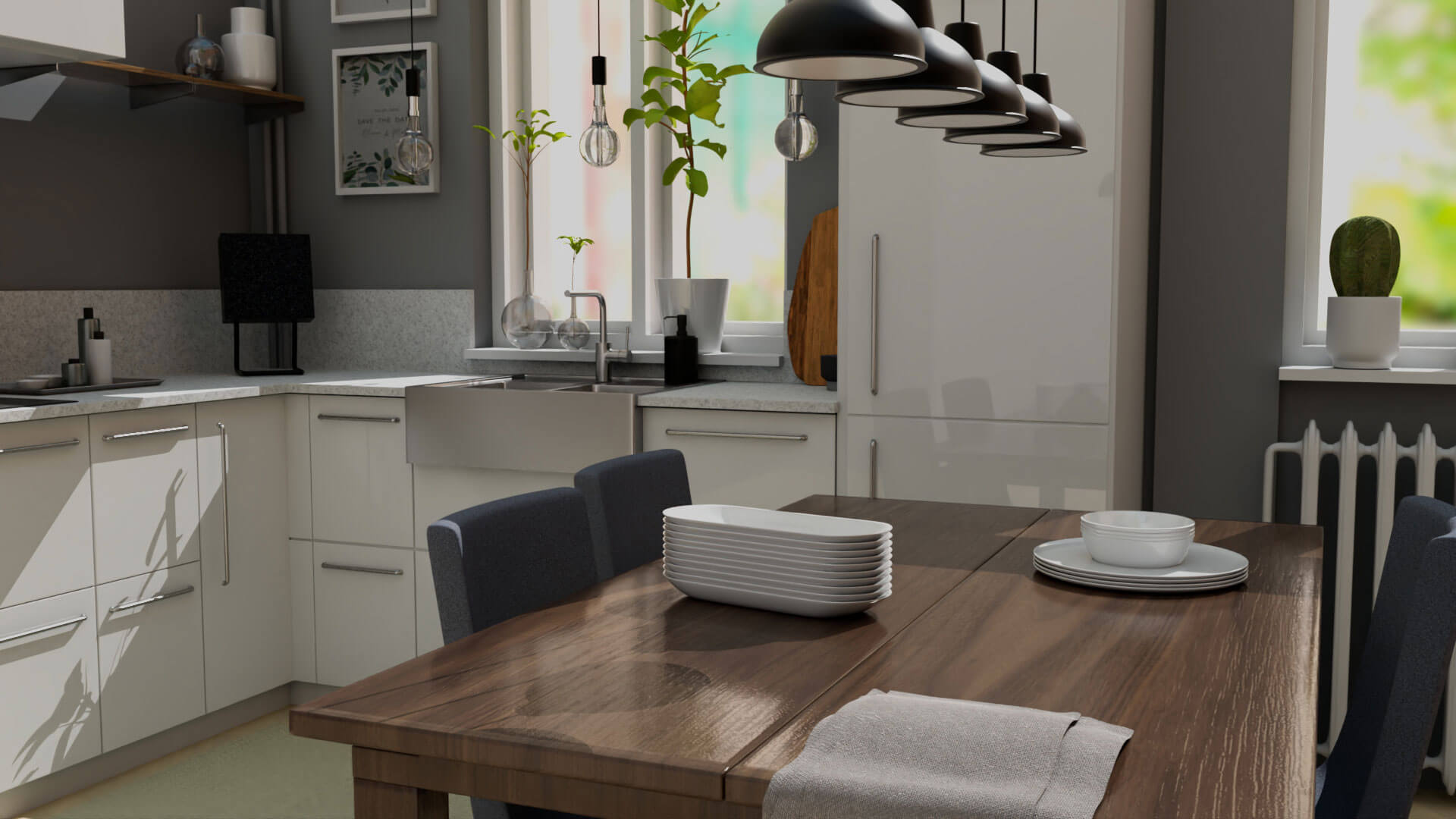 A simple kitchen with a table with plates stacked on top and counters and a sink in the background