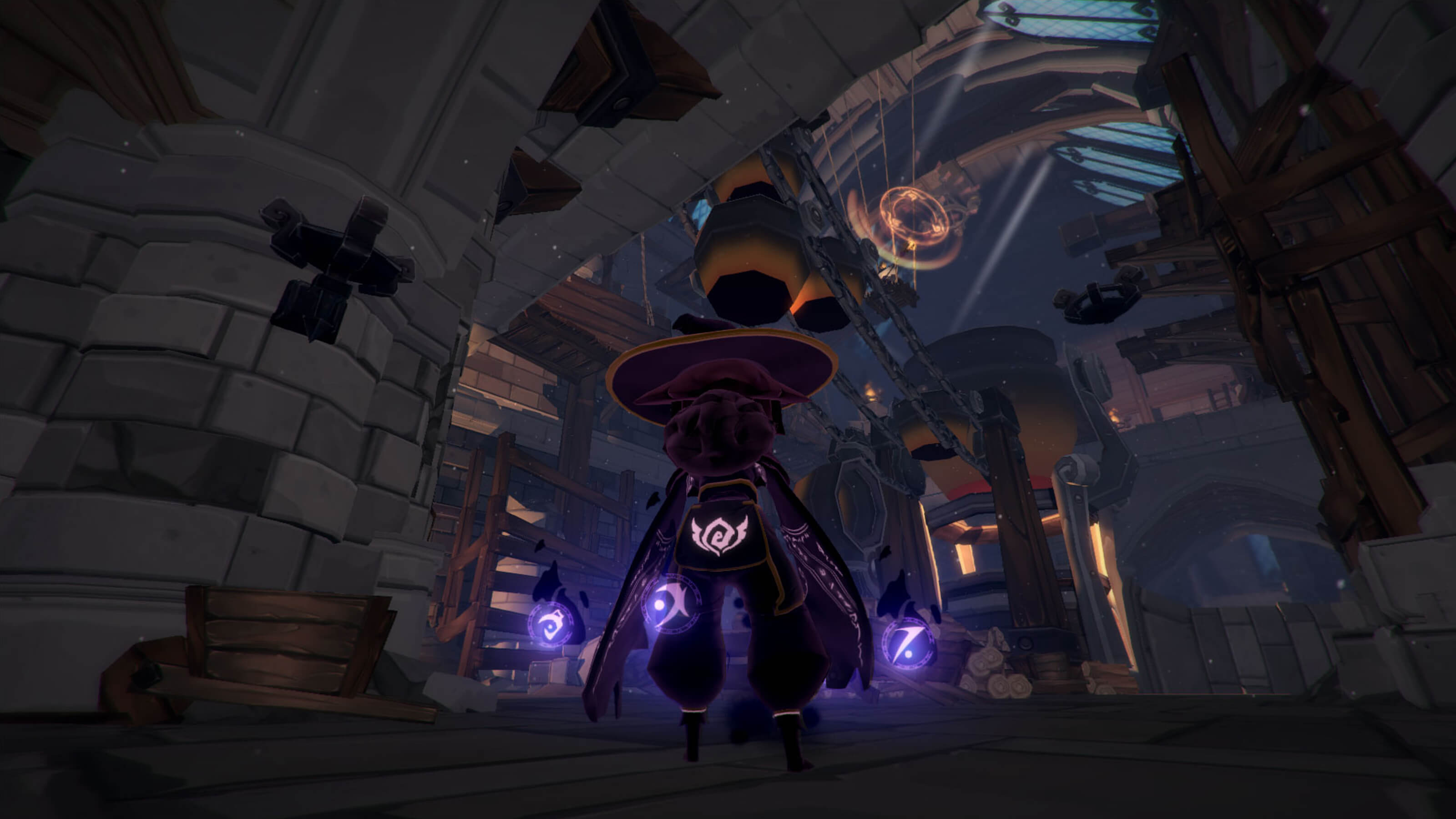 A view of the player's character in third person from behind as she stands in a large stone-and-wood structure