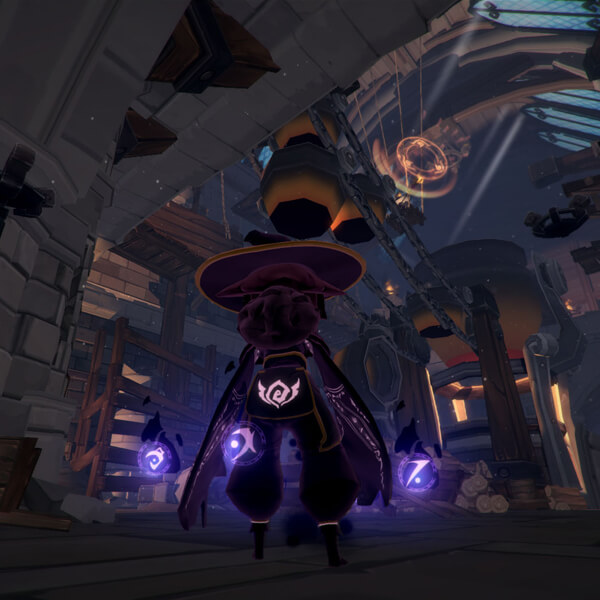 A view of the player's character in third person from behind as she stands in a large stone-and-wood structure