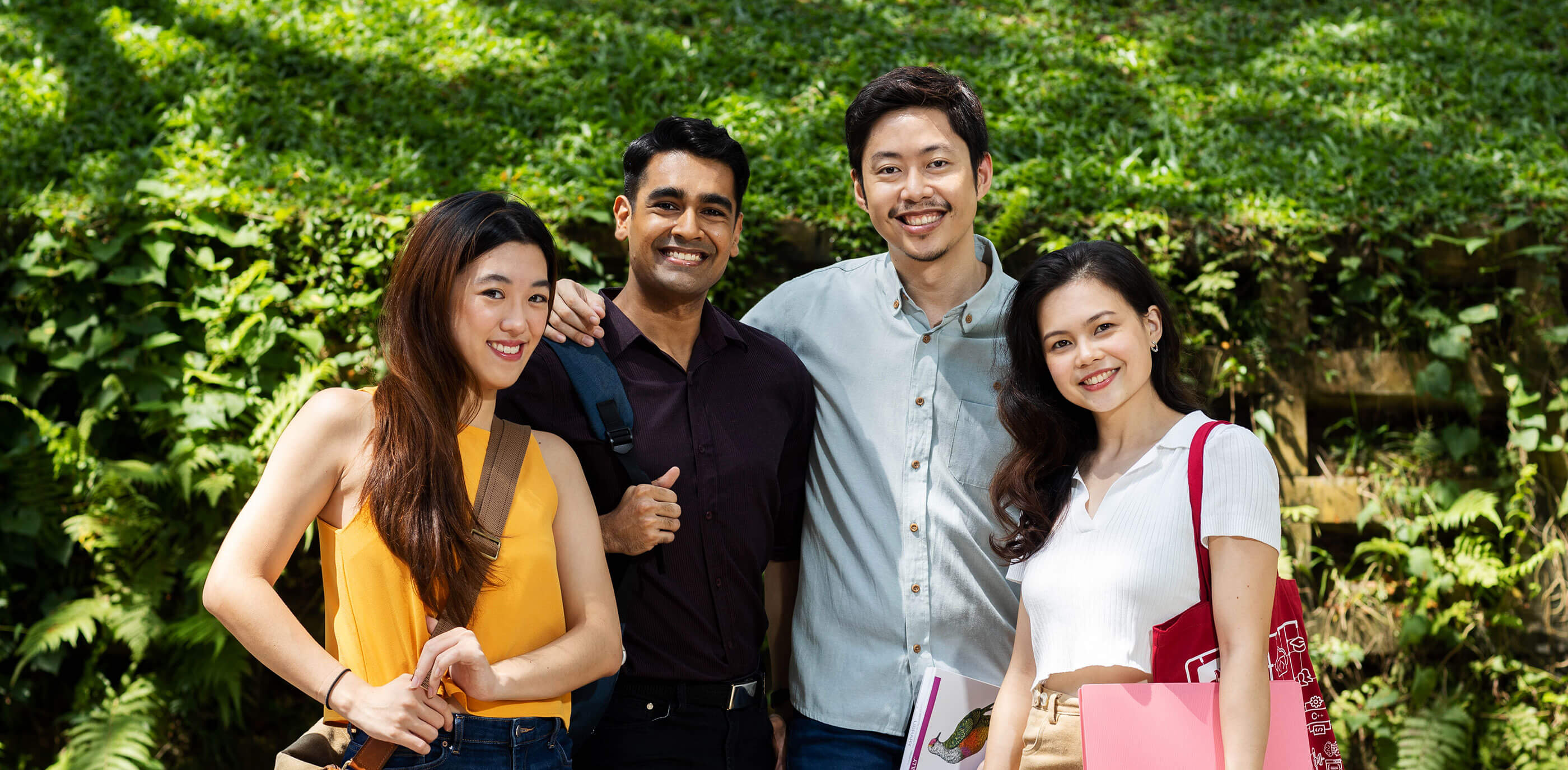 Four DigiPen (Singapore) students pose together for a photo