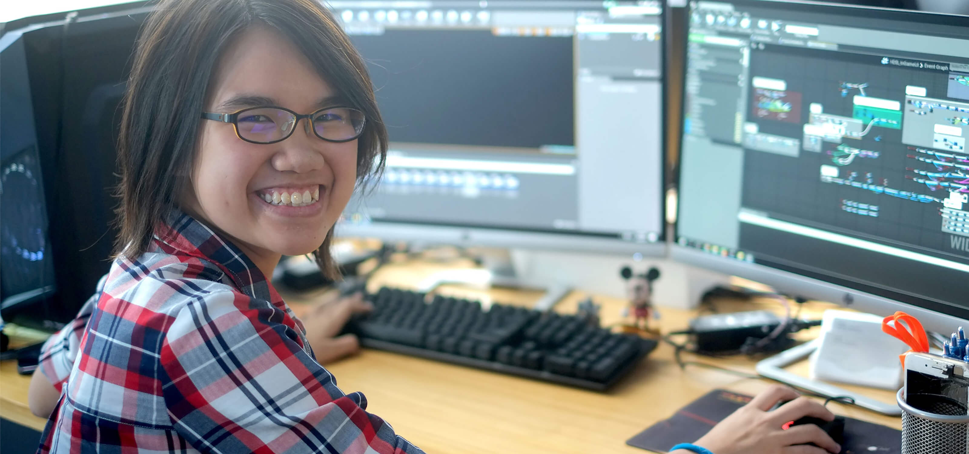 DigiPen (Singapore) BAGD graduate Chua Wan Yi at her desk in the Vouse office