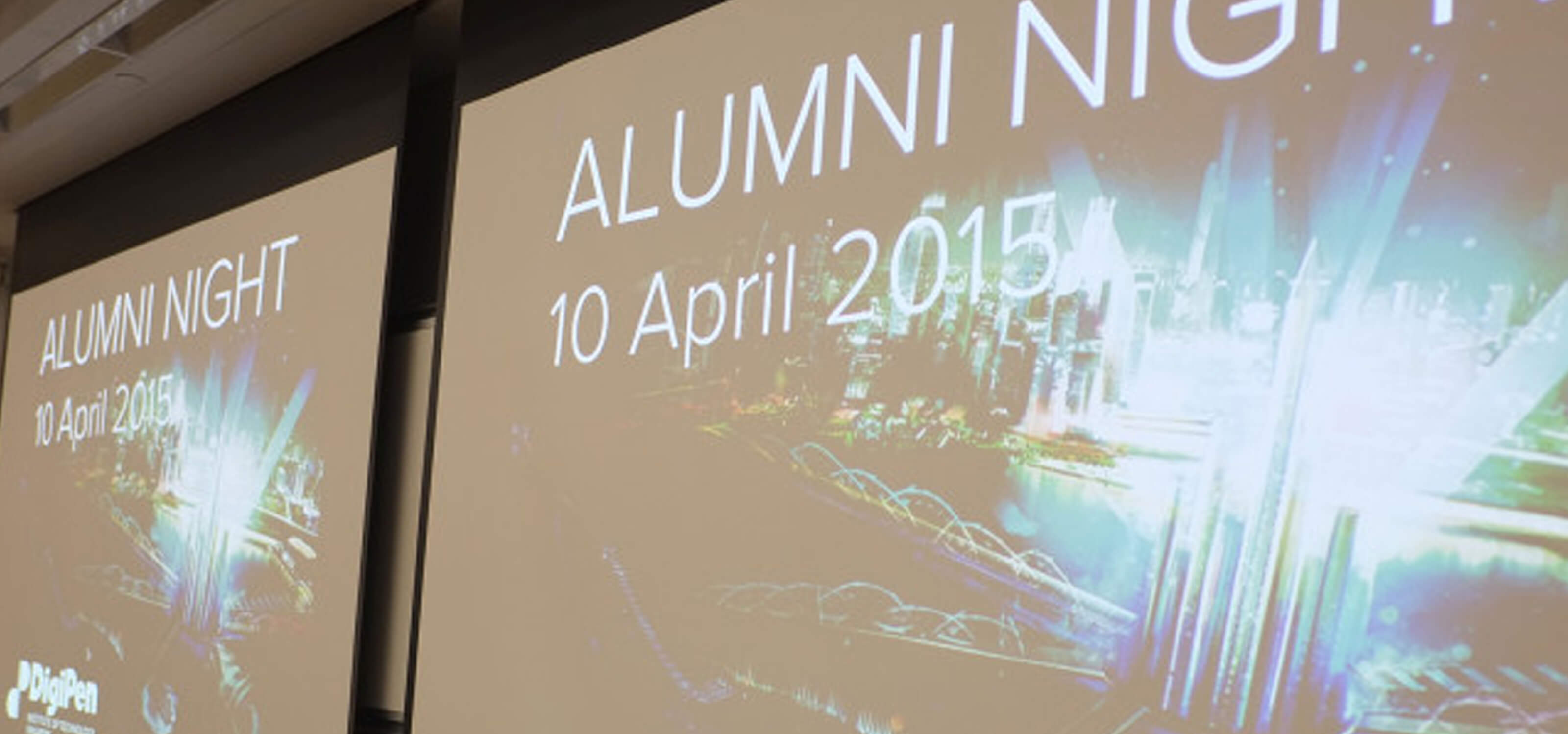 A projection screen displays "Alumni Night, 10 April 2015" and a graphic of a shining futuristic city