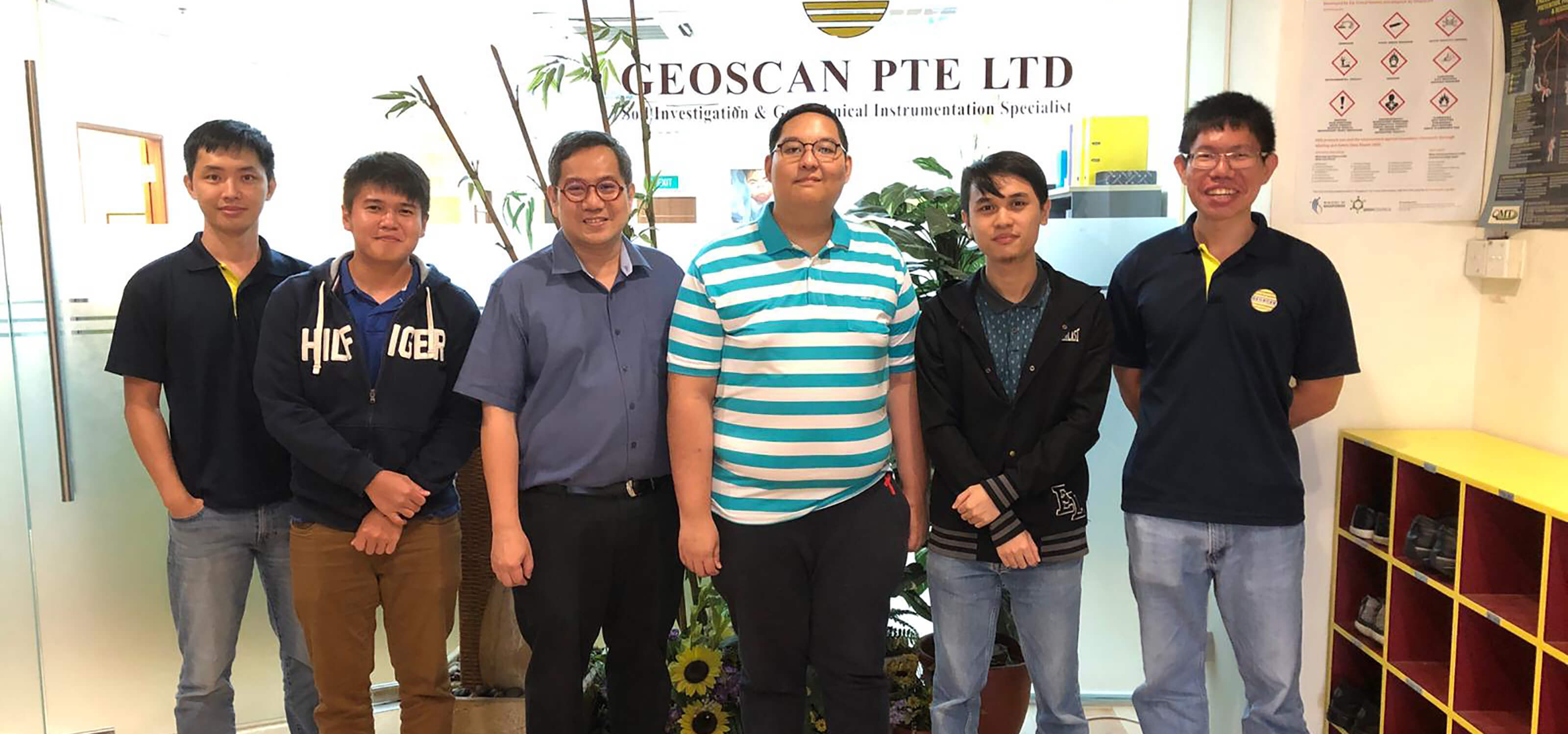 Group photo with SIT-DigiPen (Singapore) student interns Wazirullah Bin Rumzi and Zachary Ko with four Geoscan employees