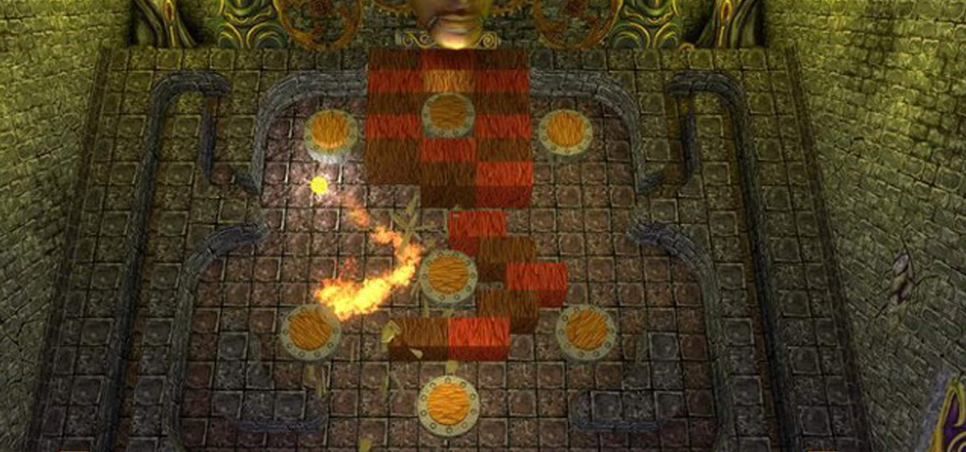 Screenshot from Terra, a ball of flame bounces off various bumpers in a dungeon-like pinball level