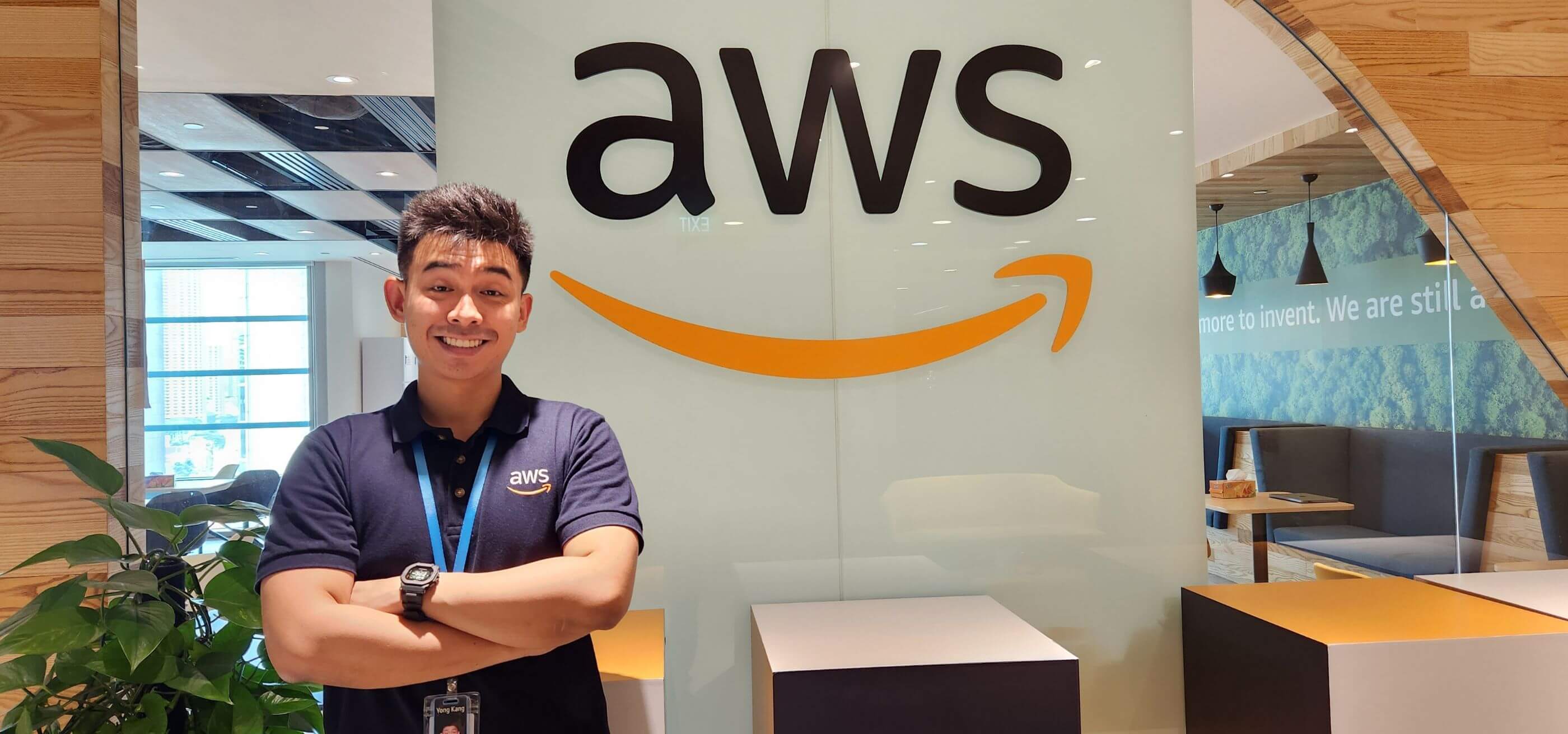 DigiPen Singapore Graduate Khoo Yong Kang poses in front of the Amazon logo