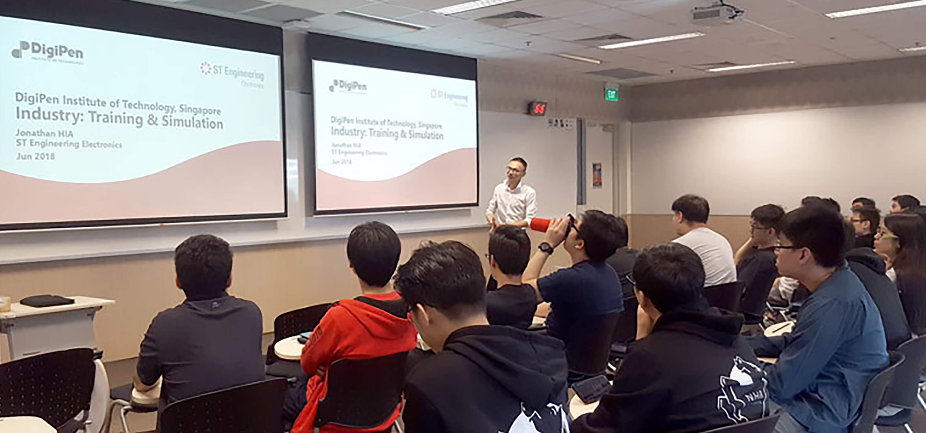 ST Engineering Assistant Division Manager Jonathan Hia speaks in front of a class of DigiPen (Singapore) students