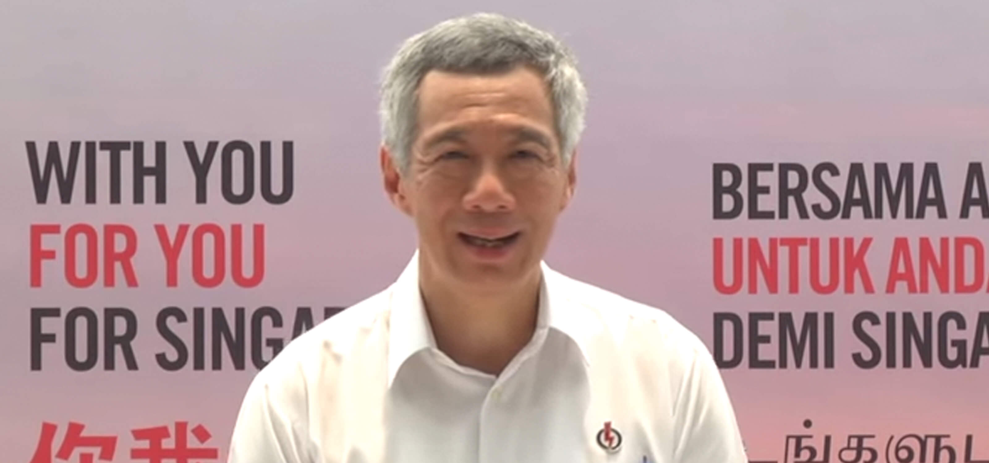 Singapore Prime Minister Lee Hsien Loong gives a speech in a white shirt