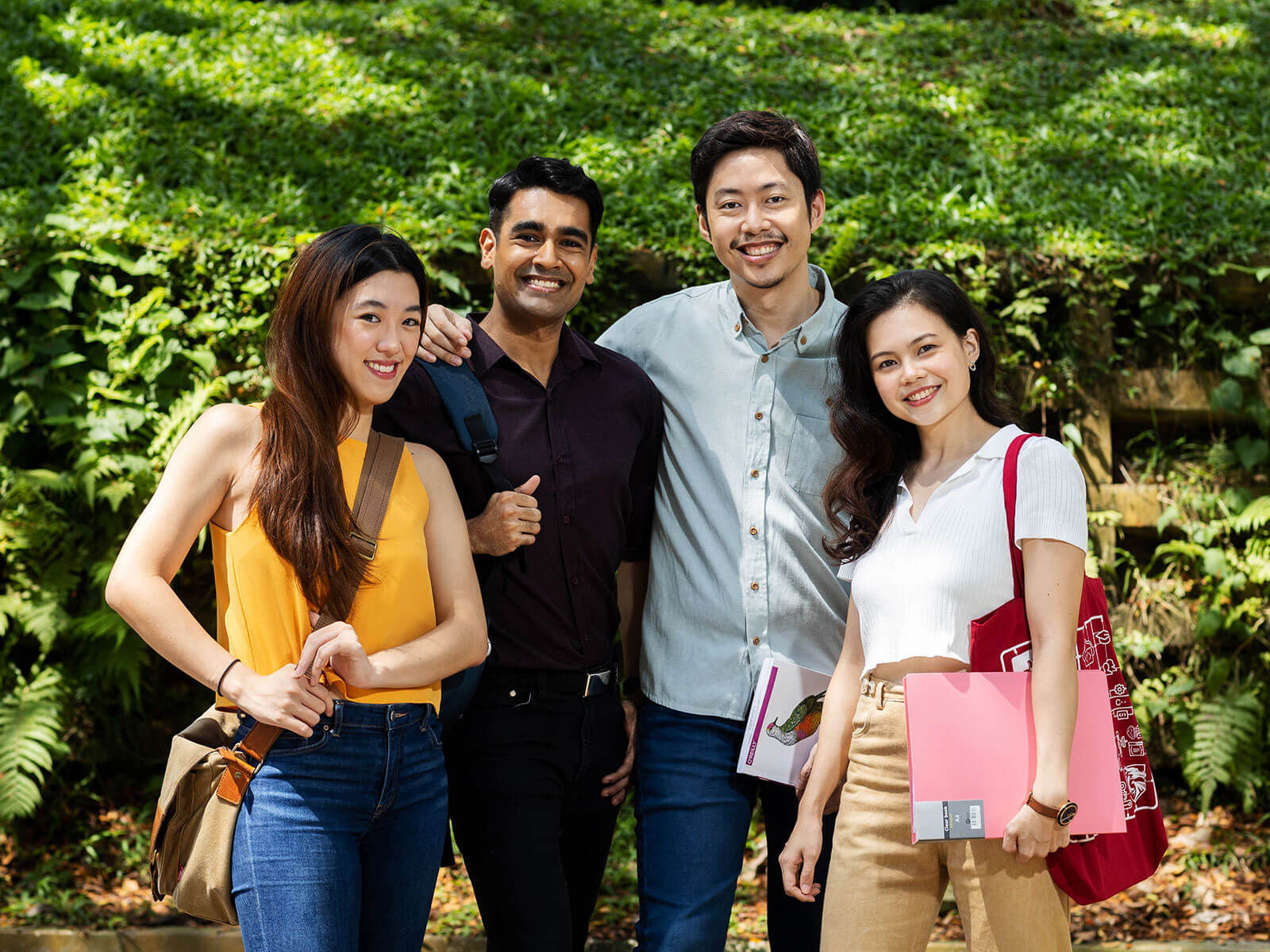 Four DigiPen (Singapore) students pose together for a photo