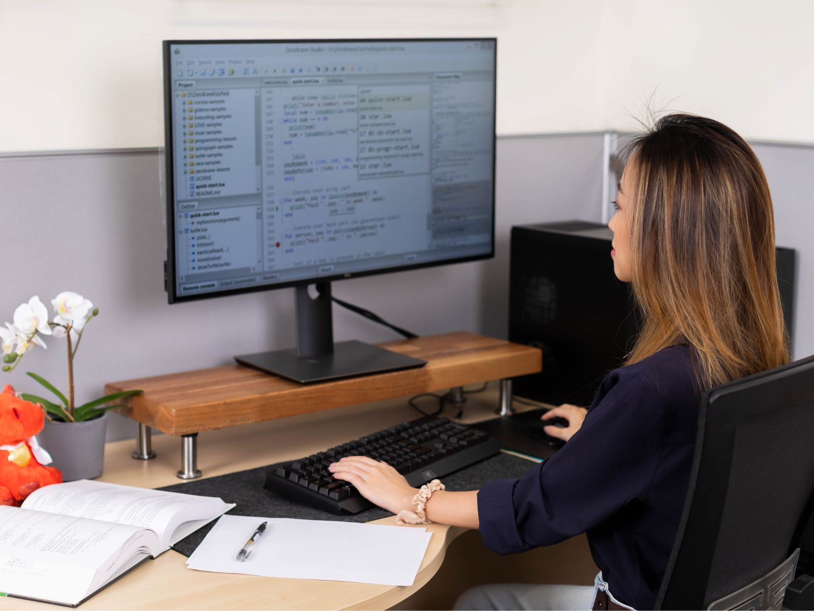 A DigiPen student working at a desk.