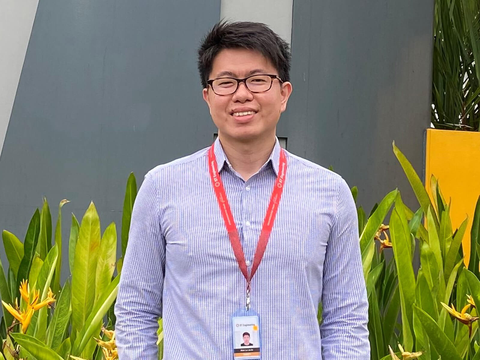 Alvin Lui stands outside the ST Engineering building.