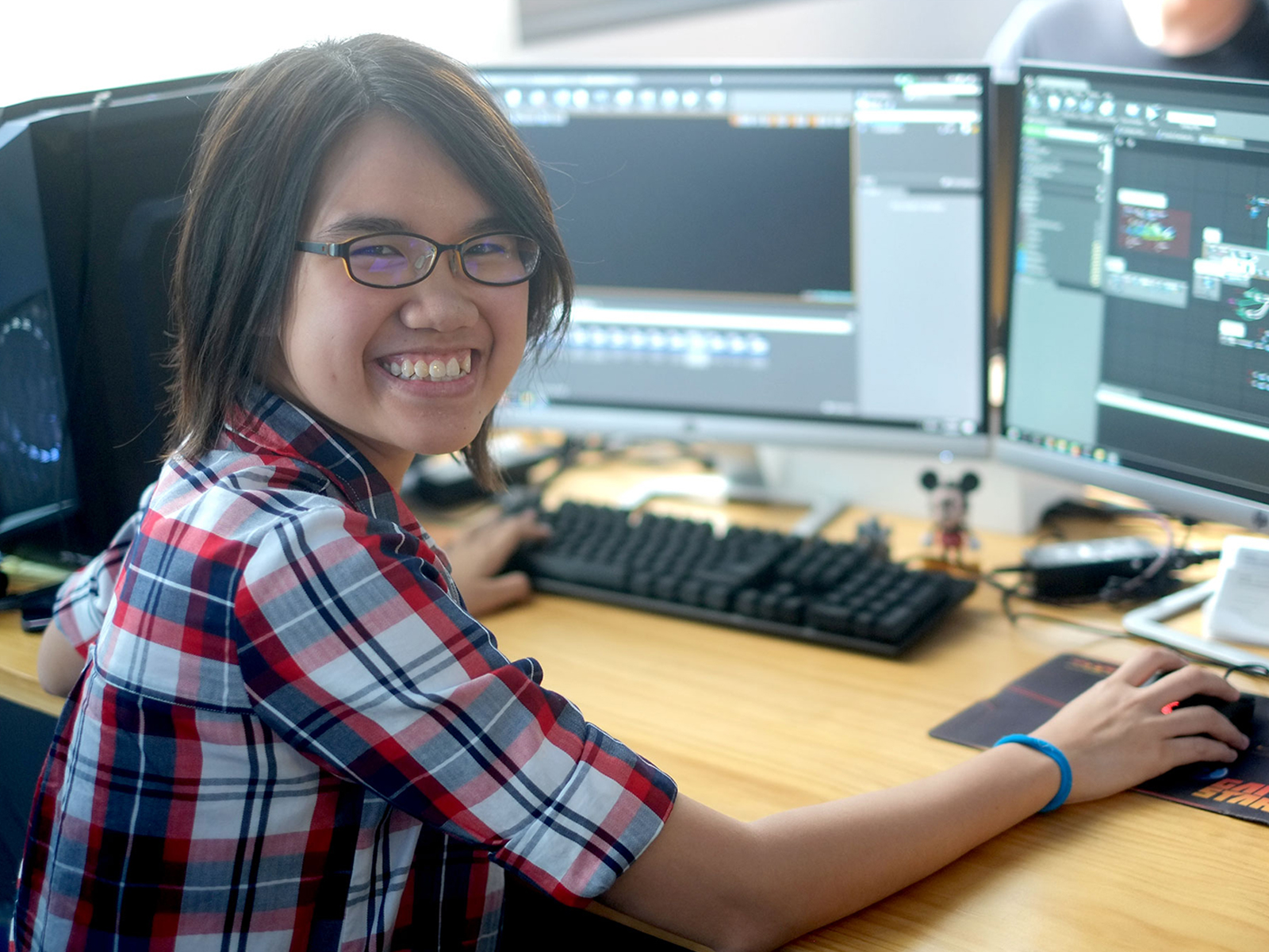 DigiPen (Singapore) BAGD alumnae Chua Wan Yi at her desk in the Vouse office