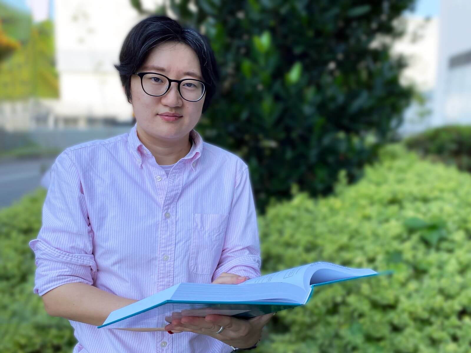 Dr. Wu Yilin poses for a photo outside