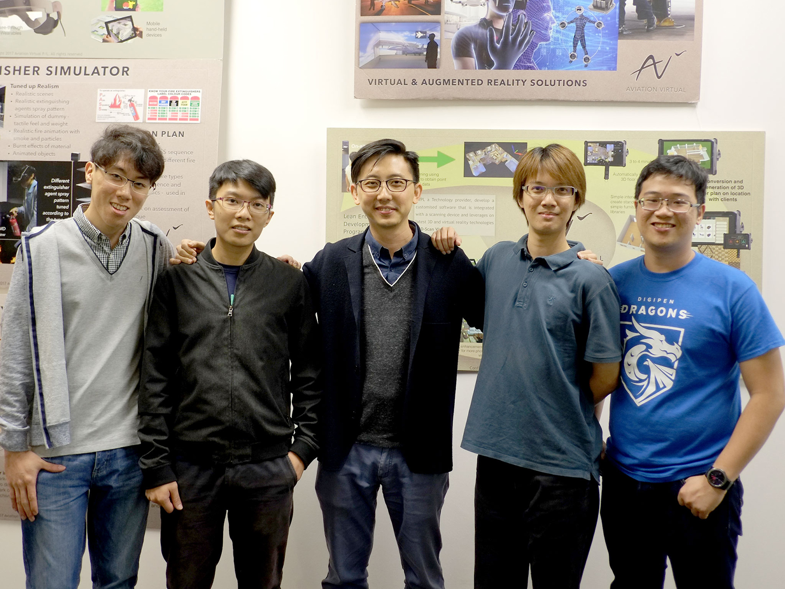 A group of DigiPen (Singapore) alumni pose at the Aviation Virtual office