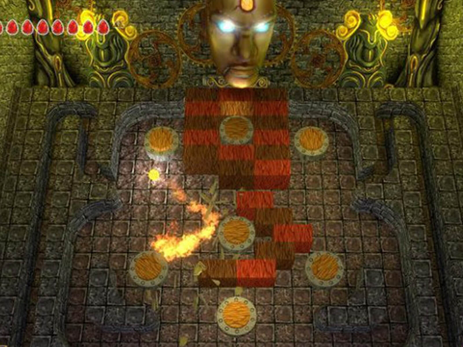 Screenshot from Terra, a ball of flame bounces off various bumpers in a dungeon-like pinball level