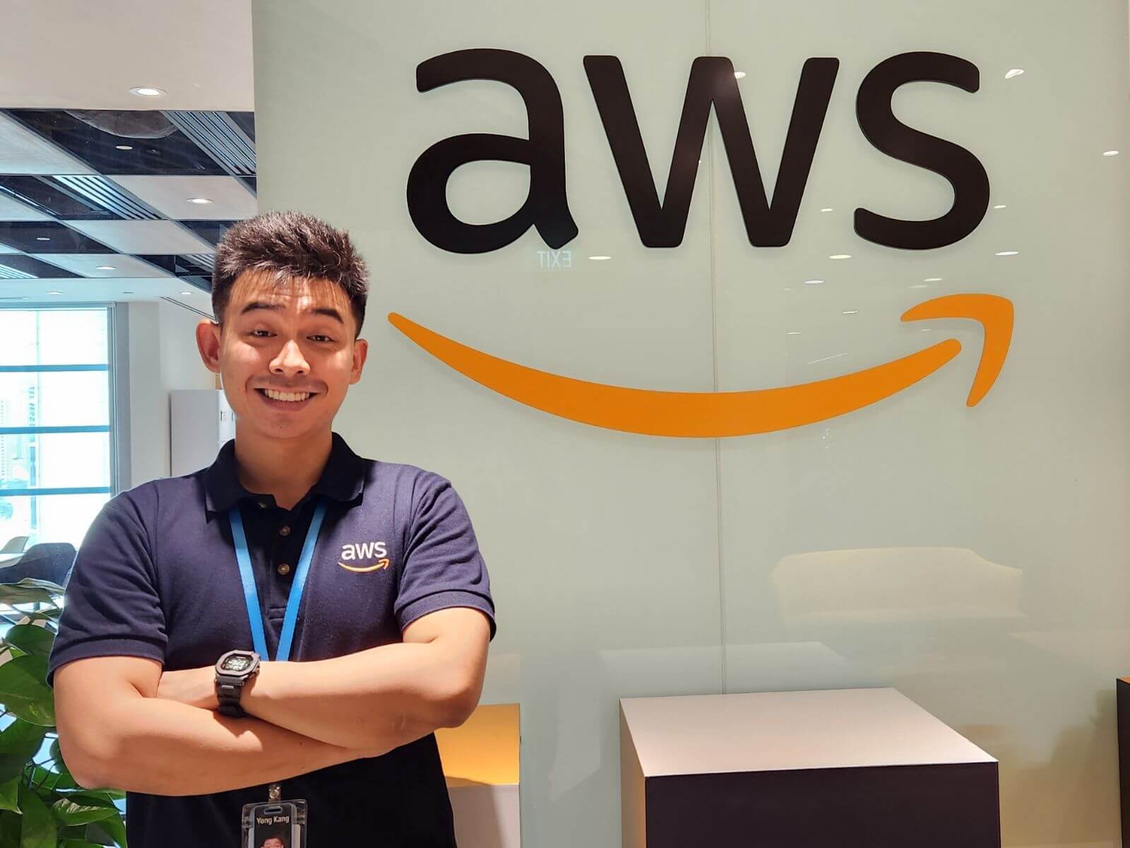 DigiPen Singapore Graduate Khoo Yong Kang poses in front of the Amazon logo