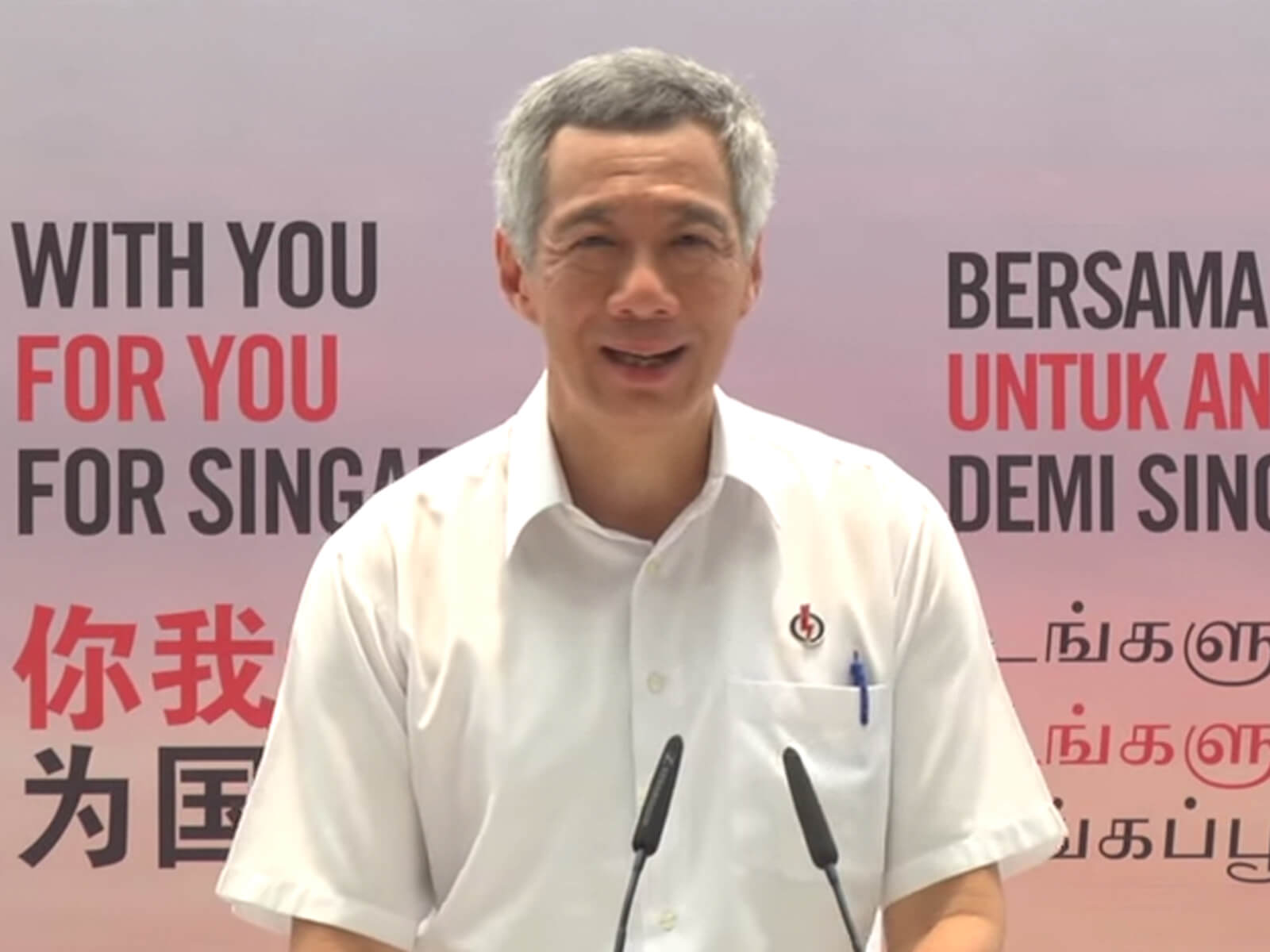 Singapore Prime Minister Lee Hsien Loong gives a speech in a white shirt