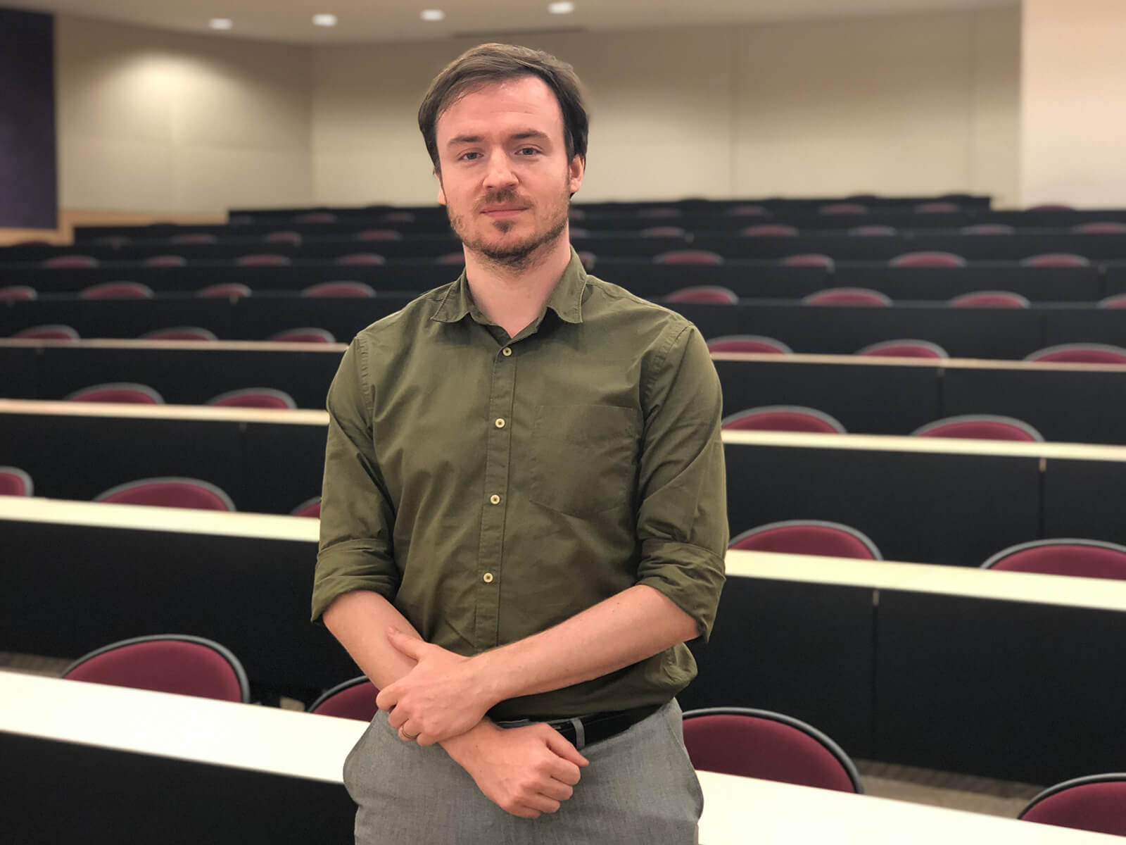 Slawomir "Swavek" Wlodkowski stands in an empty auditorium.