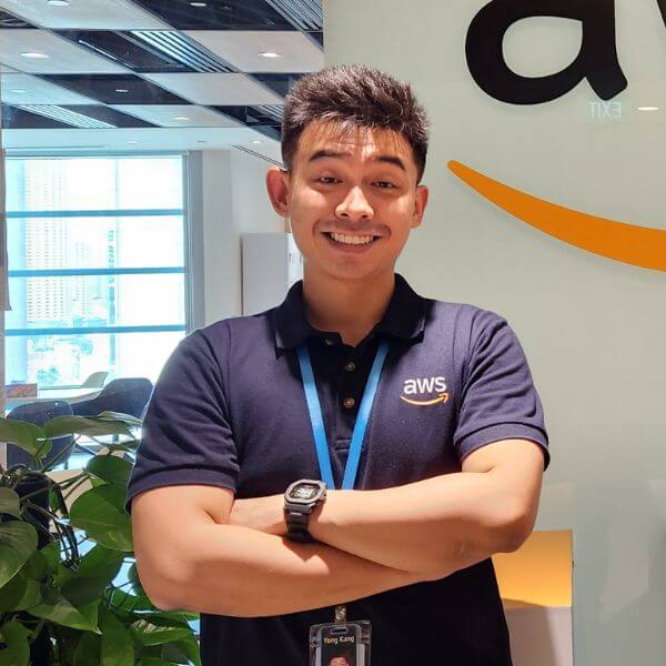 DigiPen Singapore Graduate Khoo Yong Kang poses in front of the Amazon logo