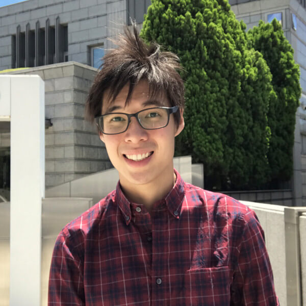 Yee Kar Kin standing in front of Koei Tecmo Singapore.