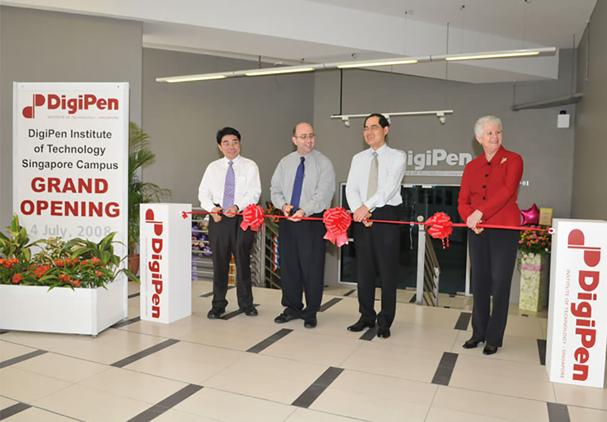 DigiPen COO Jason Chu and Founder Claude Comair cut the ribbon at the new DigiPen (Singapore) campus in 2008