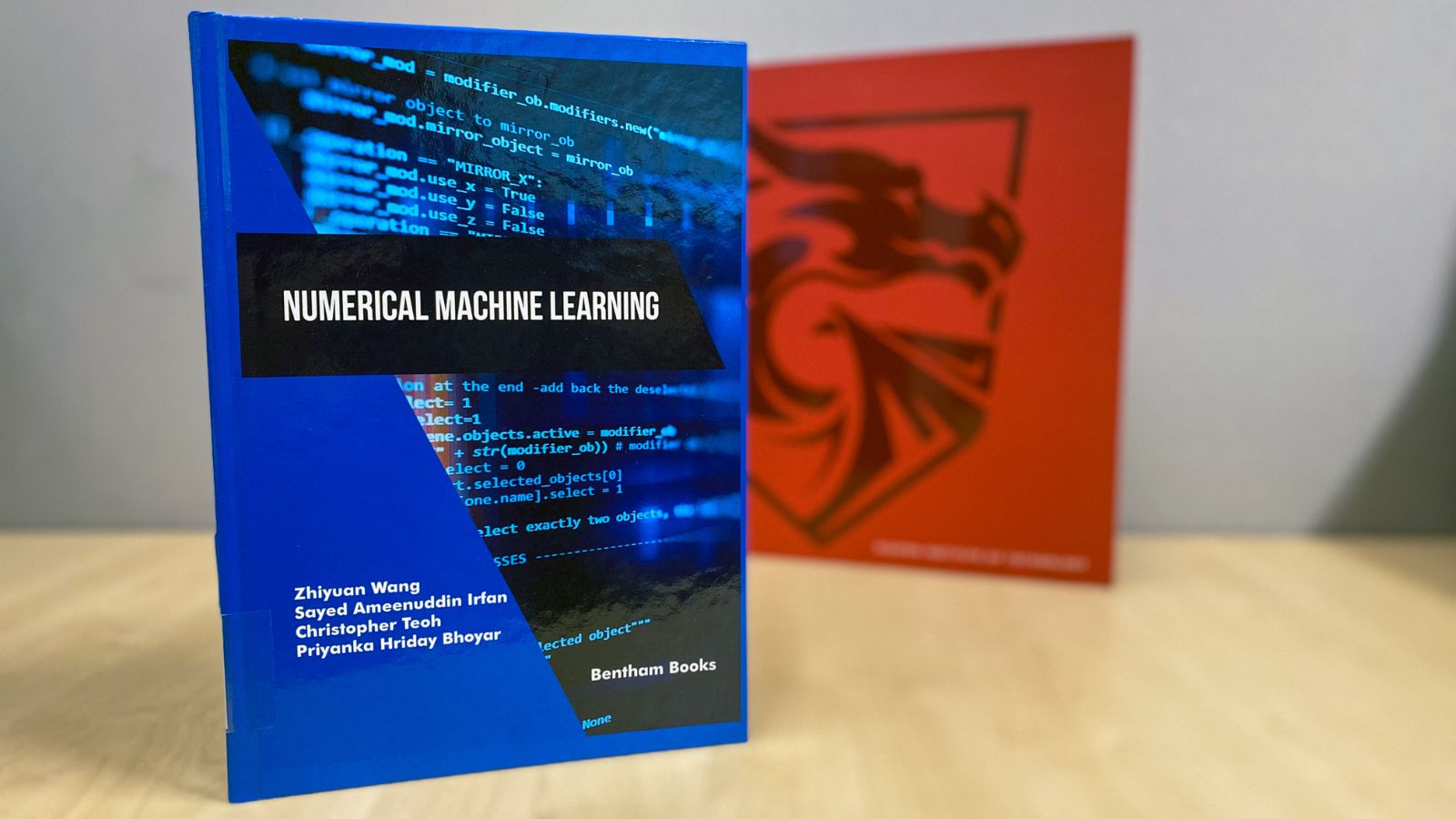 Numerical Machine Learning book stands on a table.