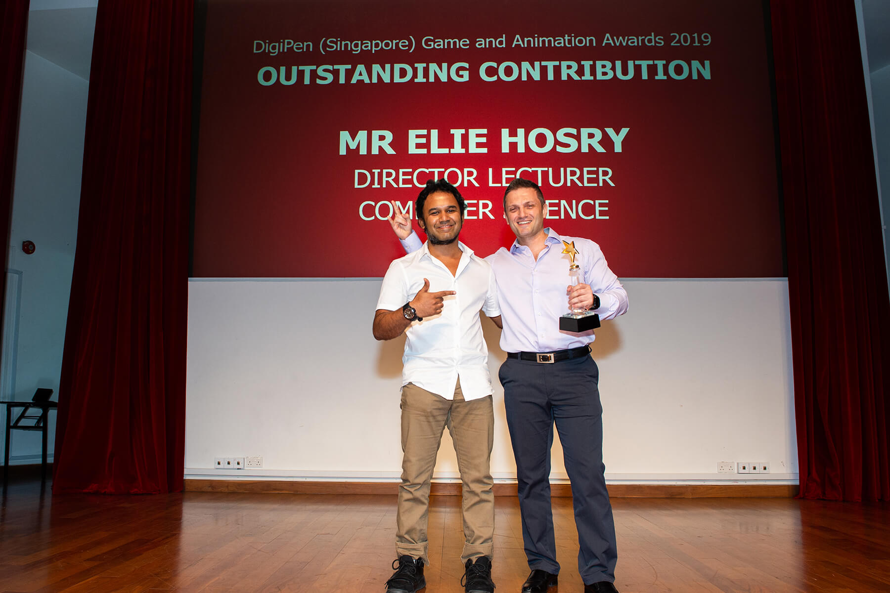 Elie Hosry accepts the Outstanding Contribution award for staff