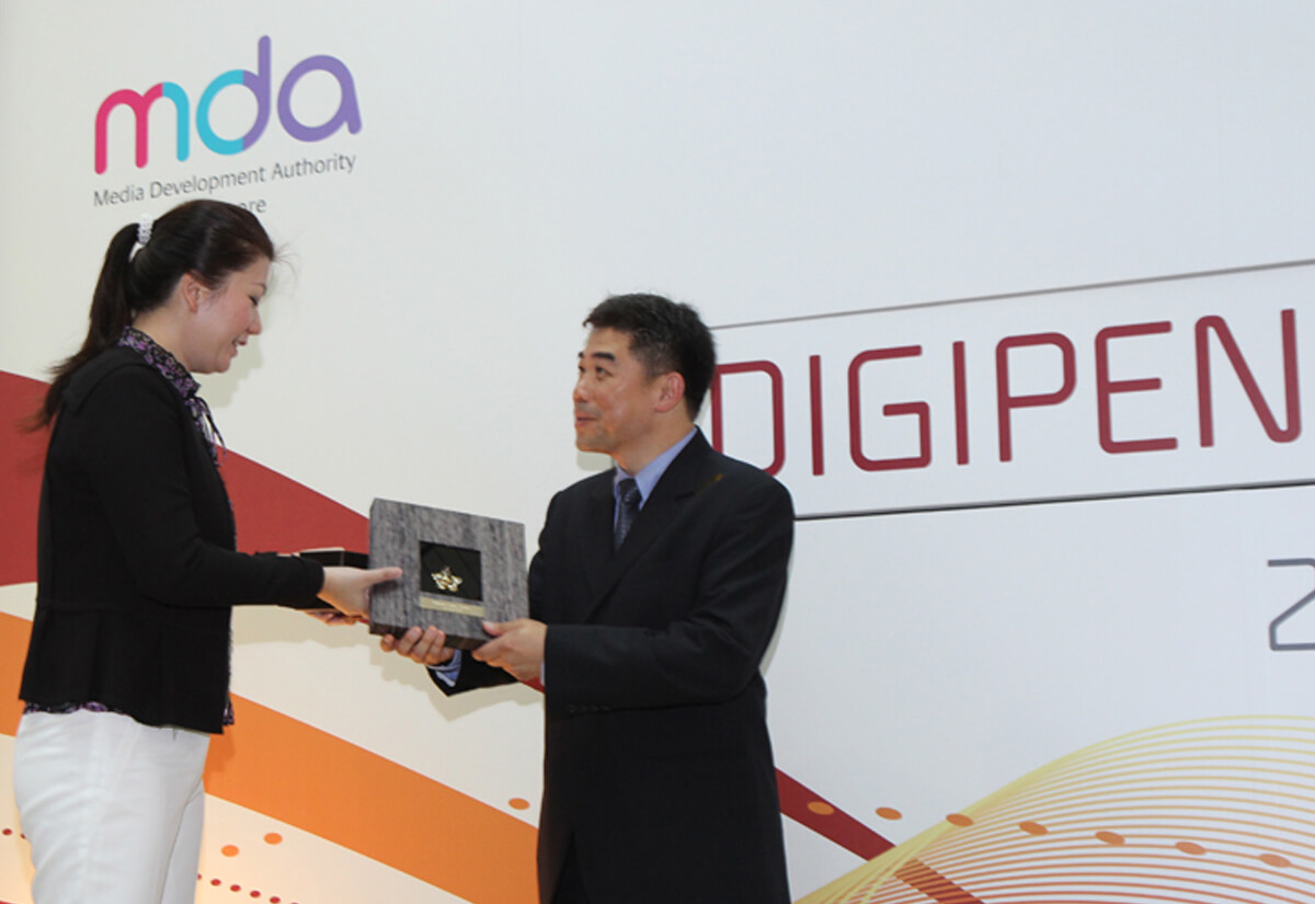 DigiPen Game Studios COO Jason Chu is presented with a plaque