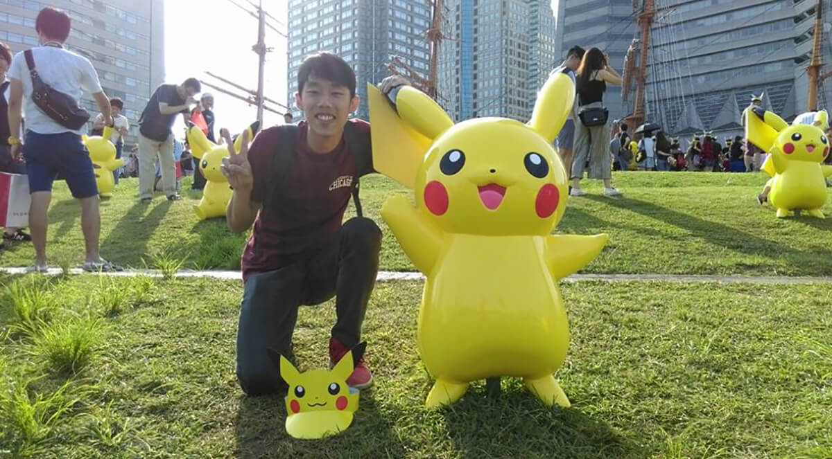 DigiPen (Singapore) alumnus Max Chew poses with Pikachu in Japan