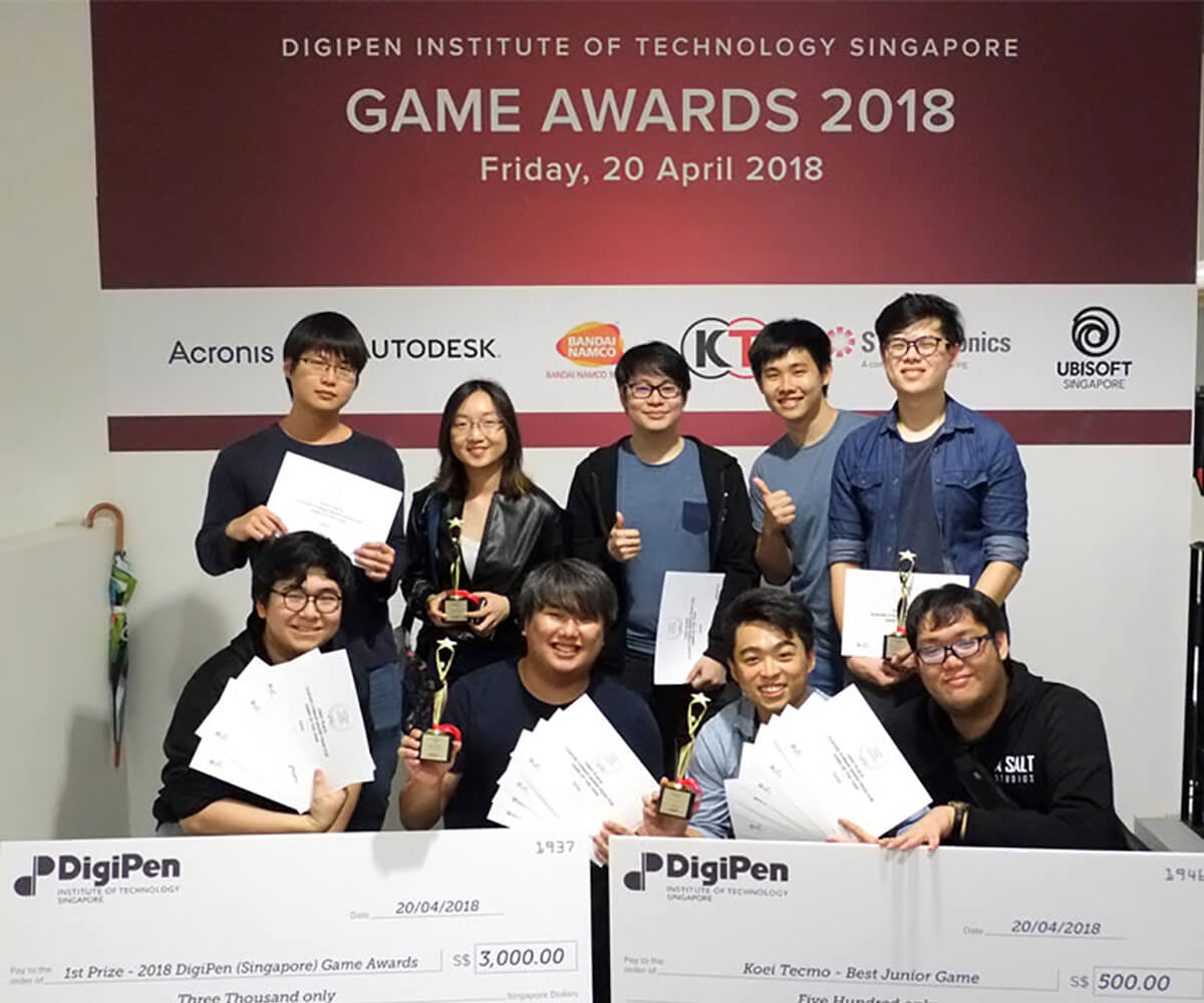 Members of DigiPen (Singapore) game team A Salt Studio pose with the trophies and checks awarded to them for the game KASA