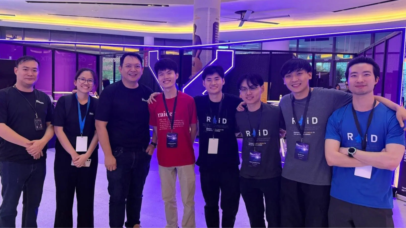 Sun Wei Hao poses with fellow coworkers.