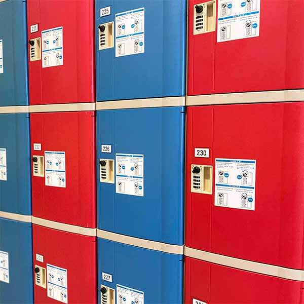 Rows of small red and blue lockers
