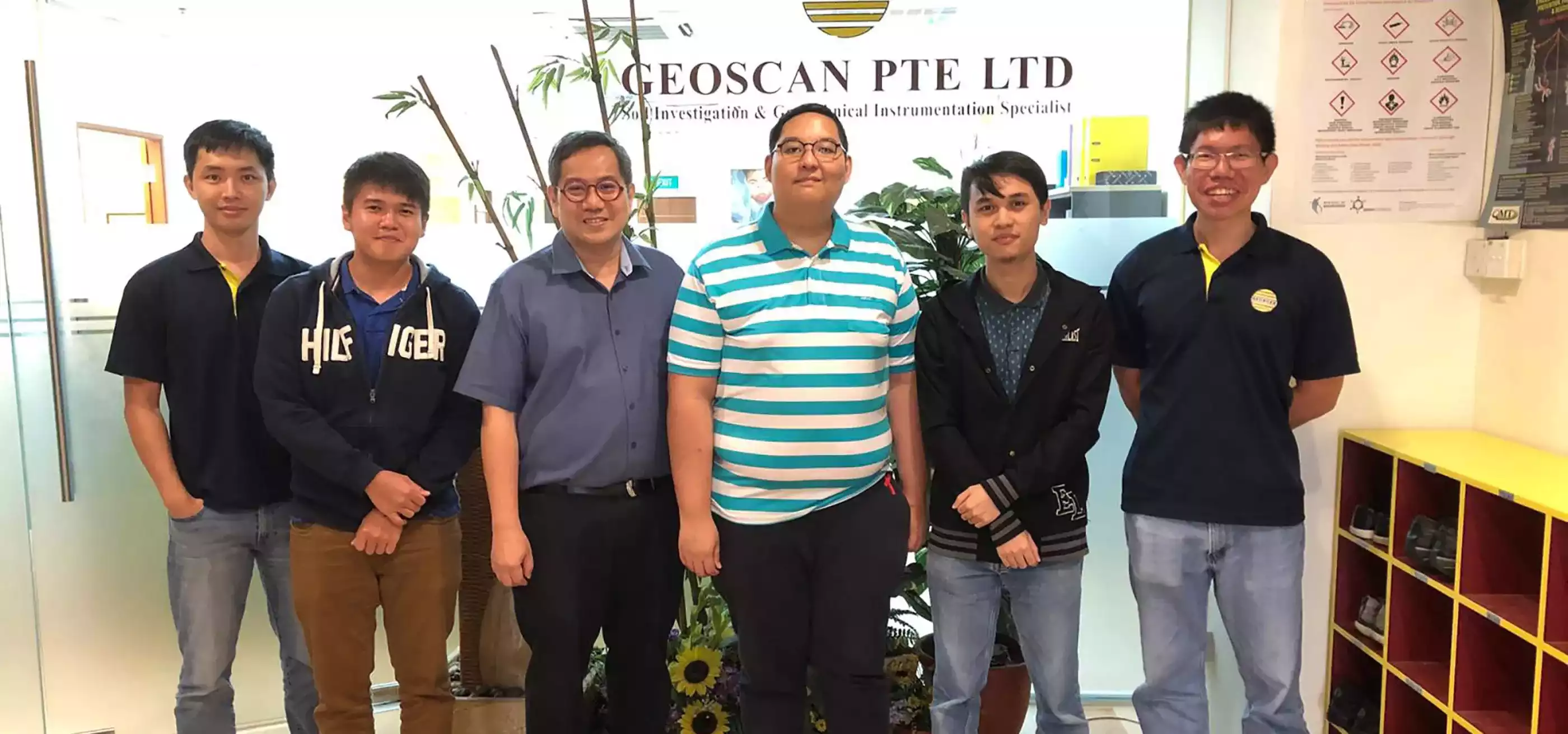 Group photo with SIT-DigiPen (Singapore) student interns Wazirullah Bin Rumzi and Zachary Ko with four Geoscan employees